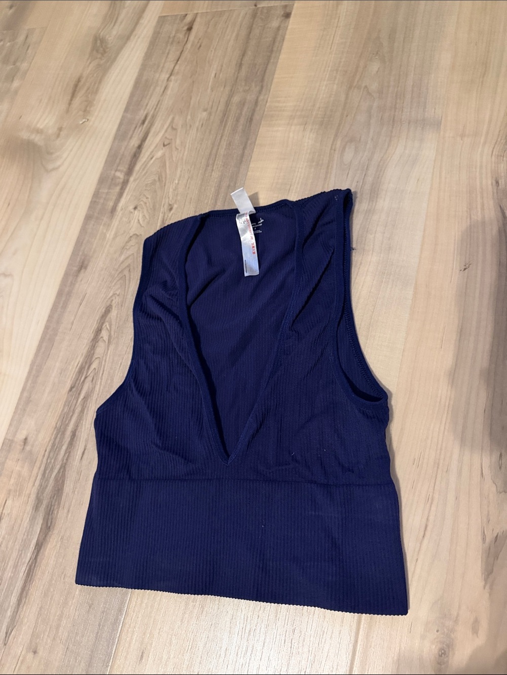 size small out from under navy cropped v neck tank top